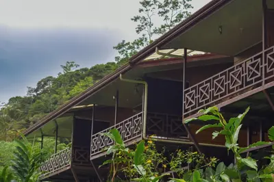 a house with balconies in the jungle at Bungalows Paraíso Celeste in Bijagua