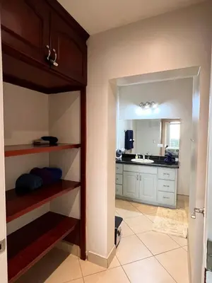 a kitchen with a open door to a kitchen with a sink at Seaside Serenity 2b2b with Panoramic Terrace in Coco