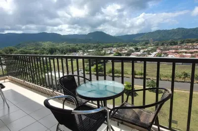 a table and chairs on a balcony with a view at Jaco Bay Condo with Great Views! in Jacó