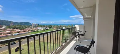 a balcony with chairs and a view of a city at Jaco Bay Condo with Great Views! in Jacó