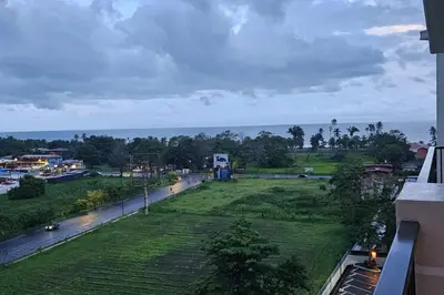 a view of a park from a balcony of a building at Jaco Bay Condo with Great Views! in Jacó