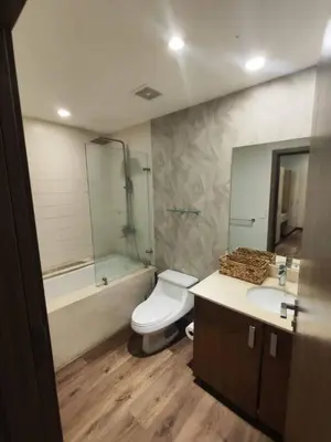 a bathroom with a toilet and a tub and a sink at Jaco Bay Condo with Great Views! in Jacó