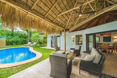 a villa with a swimming pool and a patio at Tropical Retreat - Private Pool, Steps to Beach in Tamarindo