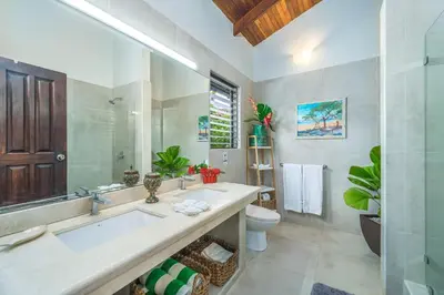 a bathroom with a tub and a toilet and a sink at Tropical Retreat - Private Pool, Steps to Beach in Tamarindo