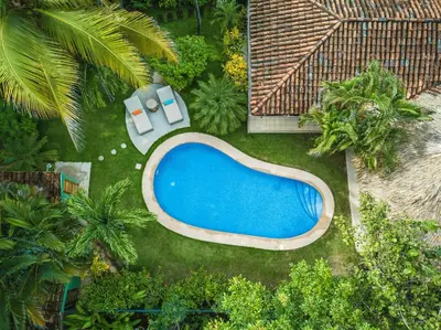 an overhead view of a swimming pool in a garden at Tropical Retreat - Private Pool, Steps to Beach in Tamarindo