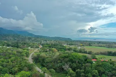 an overhead view of a road in a forest with trees at Sharma Costa Rica- Mimosa Casita in Uvita