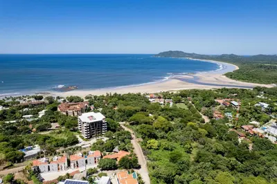 an aerial view of the beach and the ocean at Condo La Perla 163, Ocean View 3 Bedroom Penthouse in Tamarindo