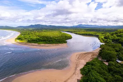 an aerial view of a beach and the ocean at Condo La Perla 163, Ocean View 3 Bedroom Penthouse in Tamarindo