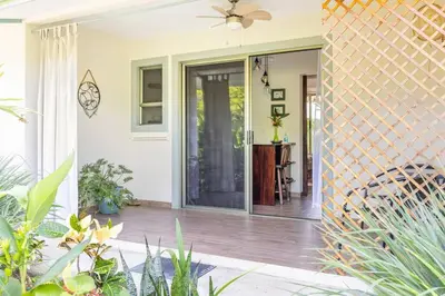 a front door of a home with plants at Beautiful studio-apartment near the beach in Uvita