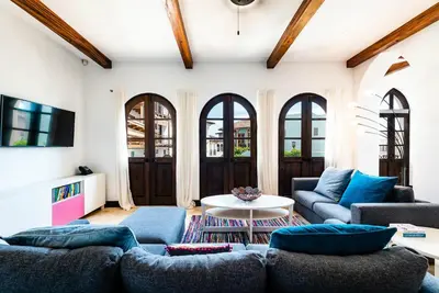 a living room with two couches and a table at Plaza Carlota 2 At Las Catalinas in Playa Danta