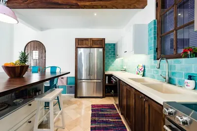 a kitchen with a stainless steel refrigerator at Plaza Carlota 2 At Las Catalinas in Playa Danta
