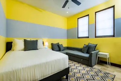 a bedroom with a bed and a couch at Plaza Carlota 2 At Las Catalinas in Playa Danta