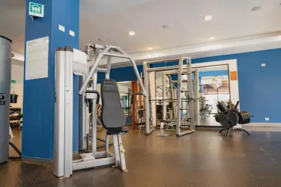 a gym with several tread machines in a room at Plaza Carlota 2 At Las Catalinas in Playa Danta