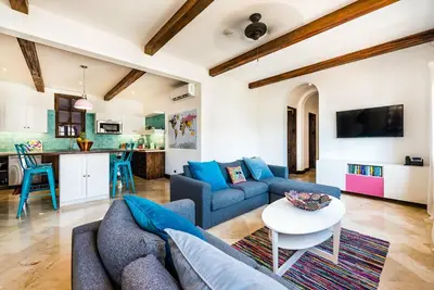 a living room with a couch and a table at Plaza Carlota 2 At Las Catalinas in Playa Danta