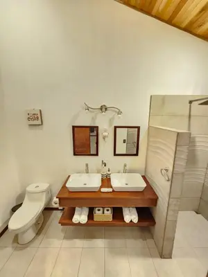a bathroom with a sink and a toilet at Itzá Casa Monteverde in Monteverde Costa Rica