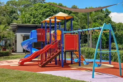 a playground in a park with a slide at Casa Eureka in Herradura