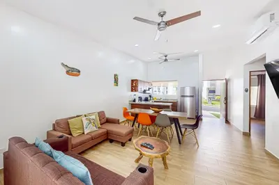 a living room with a couch and a table at Casa Eureka in Herradura
