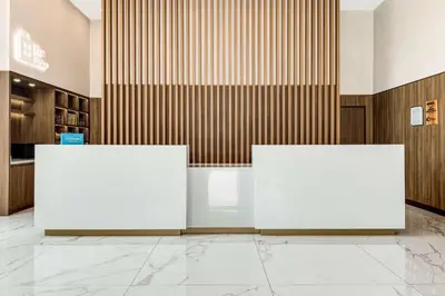 two whiteboards sitting in the middle of a lobby at Hilton Garden Inn San Jose Airport City Mall in Alajuela City