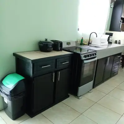 a kitchen with a stove and a counter top at Vacation Home Bartenderluisch in Fortuna