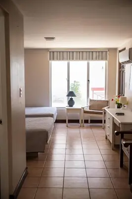 a living room with a couch and a table at VistaMar - La Morada del Ocaso in Playa Hermosa