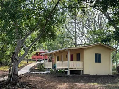 a small house in the middle of a forest at Villas La Paillote Costa Rica in Puntarenas