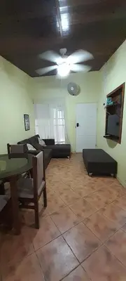 a living room with a couch and a table at Casa Mora in Jacó