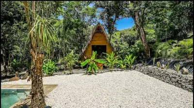 a small house in the middle of a forest at Cabinas de Lou Eco Lodge TAMARINDO do not book, under maintenance in Santa Rosa