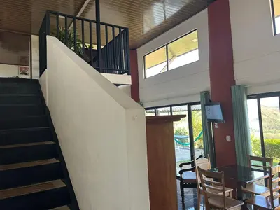 a staircase in a house with a table and chairs at Conectar con la naturaleza in Esparza