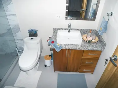 a bathroom with a toilet and a sink at Apartments Nauyaca in Platanillo