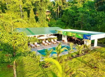an aerial view of a house with a swimming pool at Apartments Nauyaca in Platanillo
