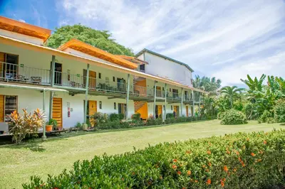an exterior view of a building with a yard at Hotel Sol Sámara in Sámara