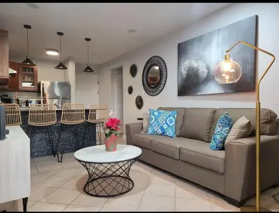 a living room with a couch and a table at Cozy Resort Beach Condo in Playa Hermosa in Sardinal