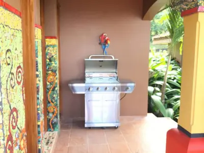 a toy kitchen with a stove in a room at Lake Arenal Killer View Villa in Tilarán