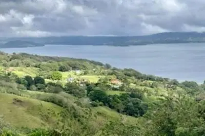 a view of a hill with a body of water at Lake Arenal Killer View Villa in Tilarán