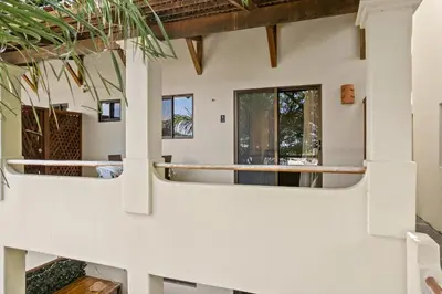 a view of the outside of a house with windows at Beautiful beach front entire condo in Coco