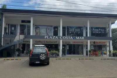 a small car parked in front of a building at Beautiful beach front entire condo in Coco