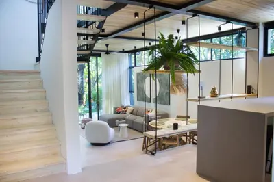 a living room with a couch and a table at D'Palm Villas in Puntarenas