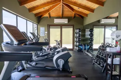 a gym with treadmills and exercise bikes in a room at 360 Splendor - Ocean-View Condo #204 in Luxury Flamingo-Complex in Playa Flamingo