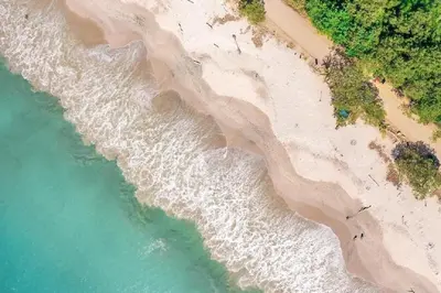 an overhead view of the beach and the ocean at 360 Splendor - Ocean-View Condo #204 in Luxury Flamingo-Complex in Playa Flamingo