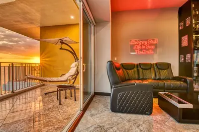 a living room with a couch and a chair at SecretJaco - Luxury Beach Front Penthouse with Pool & Jacuzzi in Jacó