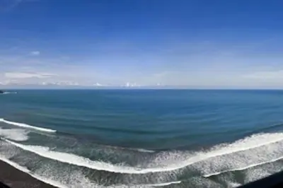 a view of a large body of water with waves at SecretJaco - Luxury Beach Front Penthouse with Pool & Jacuzzi in Jacó