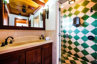 a bathroom with a sink and a shower at Casa Arrecife - 5bdr Beachfront Villa - Ethereal sunsets in Tamarindo