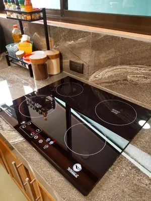 a black stove top oven sitting on top of a counter at Arenal Palacios in Fortuna
