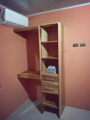 a book shelf in a corner of a room at Arenal Palacios in Fortuna