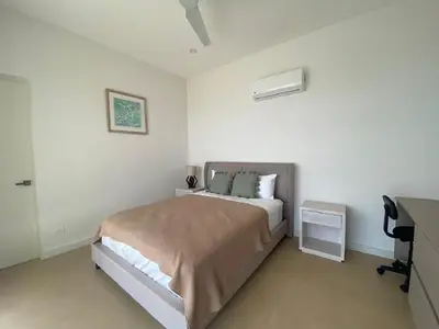 a white bedroom with a bed and a desk at CASA AYLA B - charming 2BR ocean view condo in Flamingo in Playa Flamingo