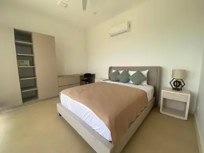 a bedroom with a large bed and a night stand at CASA AYLA B - charming 2BR ocean view condo in Flamingo in Playa Flamingo