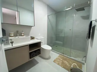 a bathroom with a shower and a toilet and a sink at AYLA C - new, cozy Ocean view Studio in Flamingo in Playa Flamingo