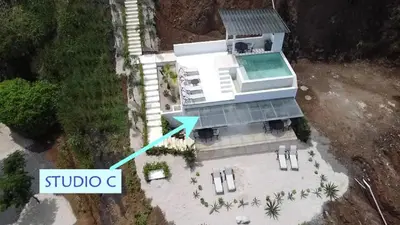 an aerial view of a house with a blue arrow at AYLA C - new, cozy Ocean view Studio in Flamingo in Playa Flamingo