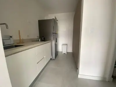 a kitchen with white cabinets and a refrigerator at AYLA D - lovely Ocean view Studio in Flamingo in Playa Flamingo