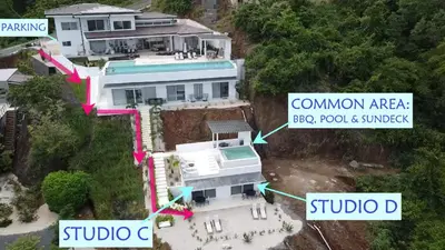 an aerial view of a white house with a swimming pool at AYLA D - lovely Ocean view Studio in Flamingo in Playa Flamingo